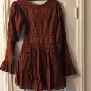Rust trumpet sleeve dress